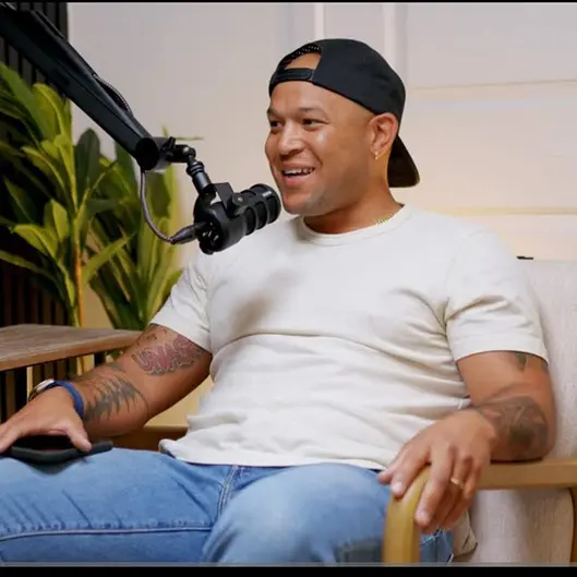 PJ Sparks speaking into a microphone during an interview